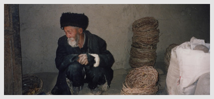 Basket weaver at rest in his workroom